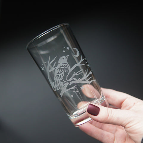 Crow highball glass held in a hand