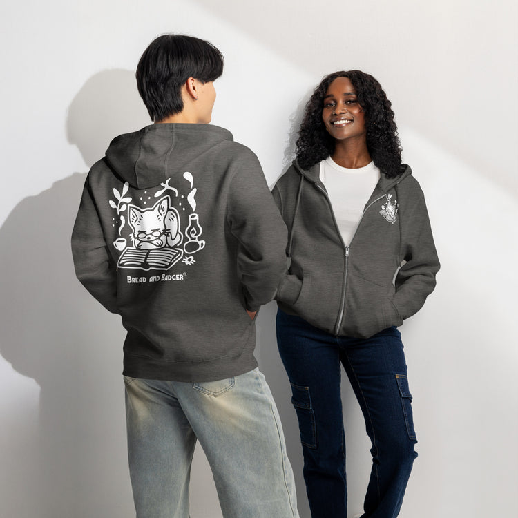 Two people wearing charcoal heather hoodies with white graphics on a plain background