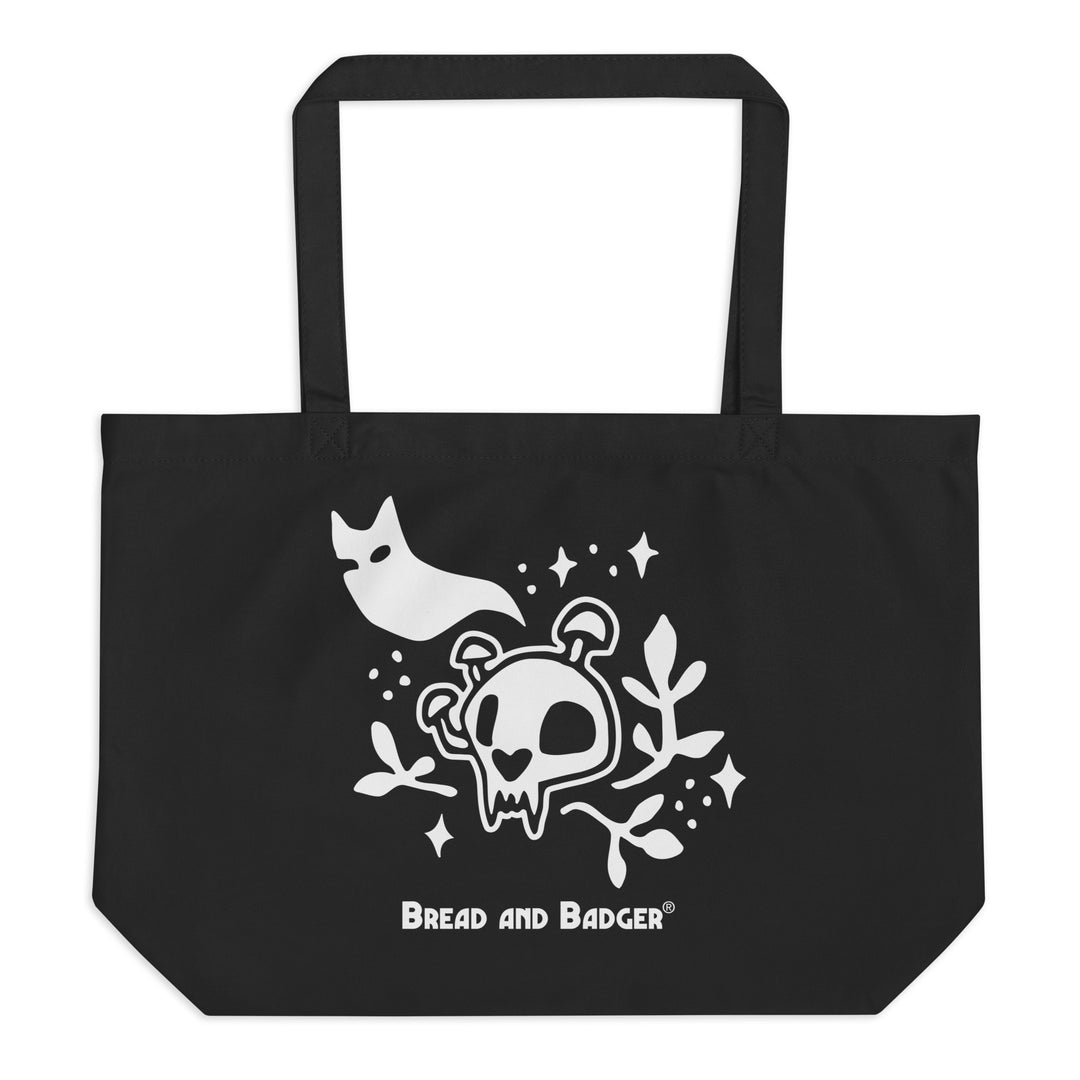 Black tote bag with white skull and cat ghost design and 'Bread and Badger' logo.