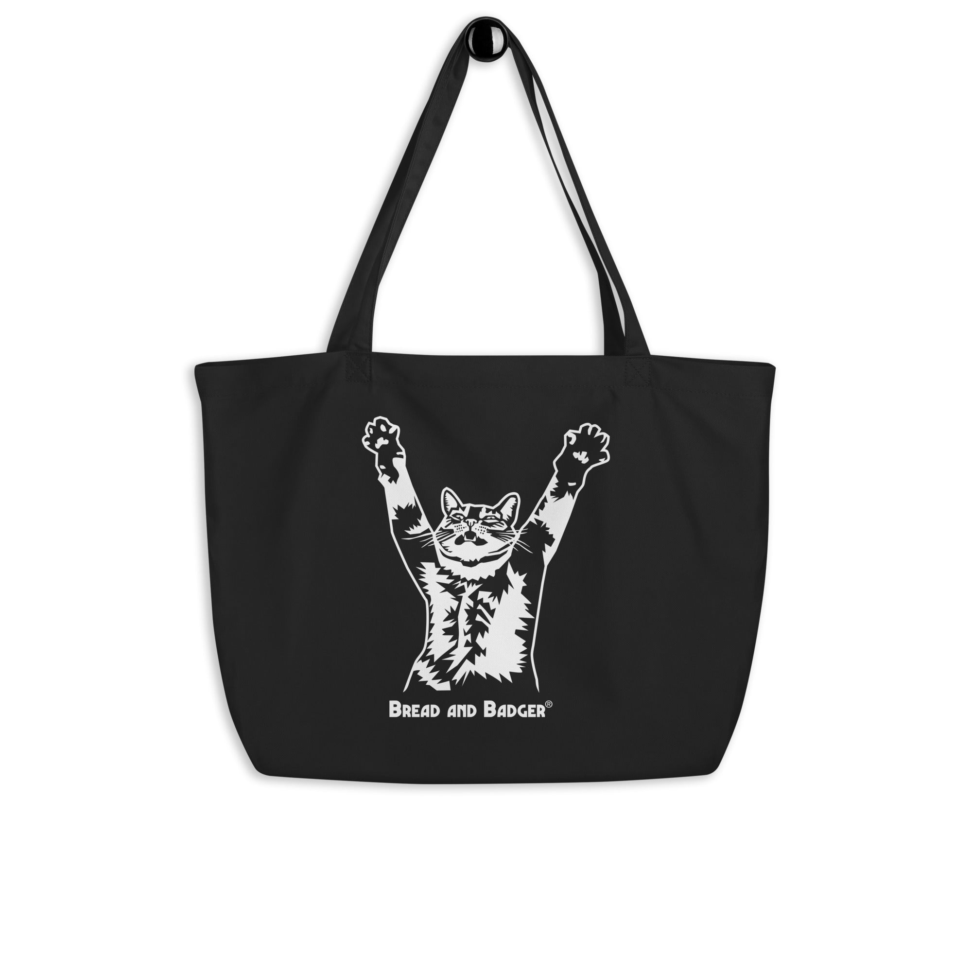 Black tote bag with a white graphic of a cat and text 'Bread and Badger' on a white background