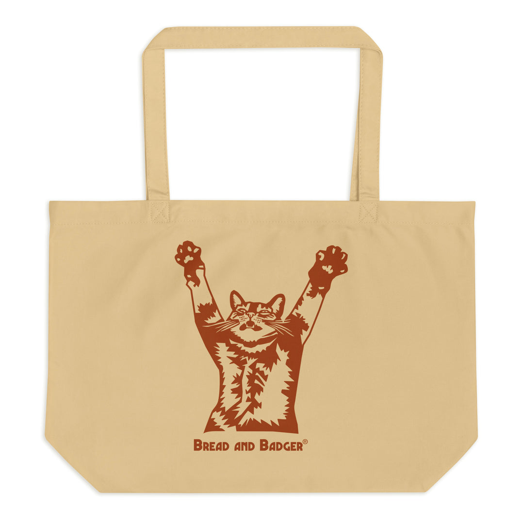 Beige tote bag with a brown graphic of a cat and 'Bread and Badger' text on a white background