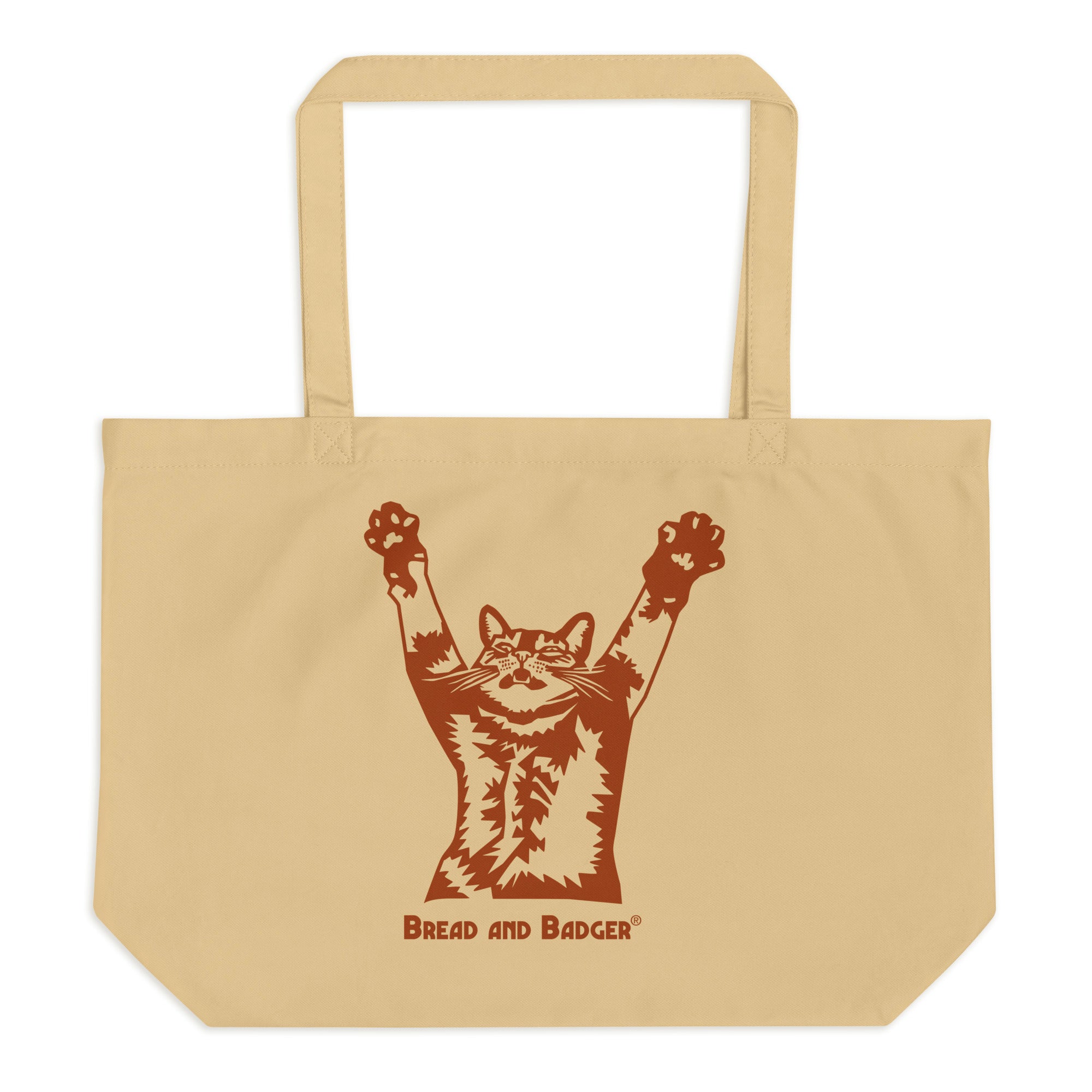 Beige tote bag with a brown graphic of a cat and 'Bread and Badger' text on a white background
