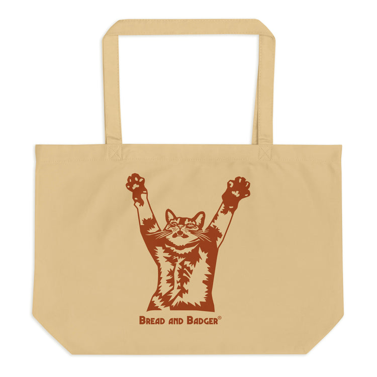 Beige tote bag with a brown graphic of a cat and 'Bread and Badger' text on a white background