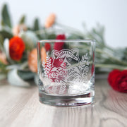 lowball glass etched with a cute raccoon
