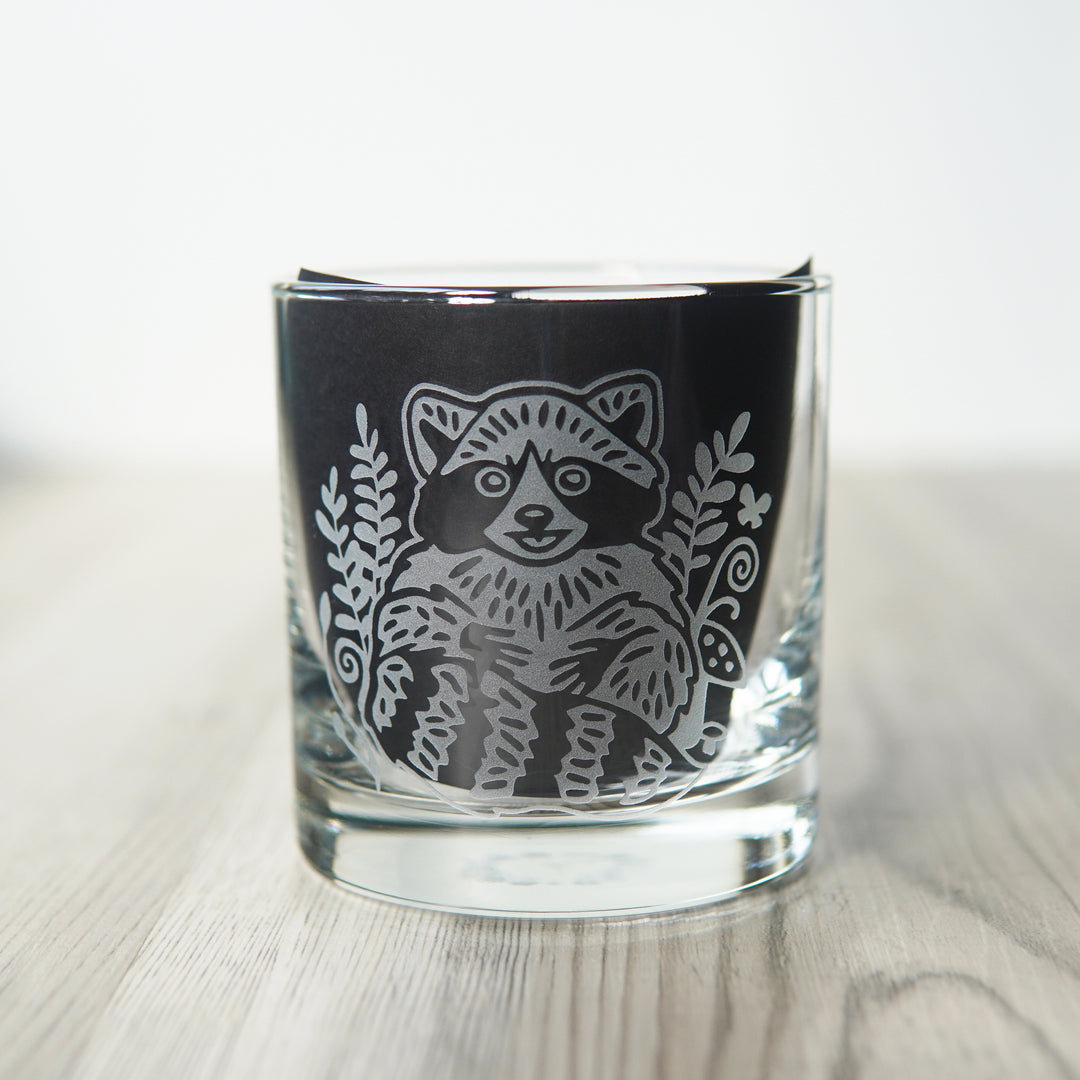 lowball glass etched with a cute raccoon