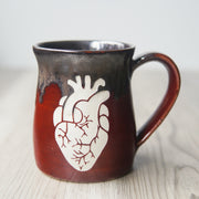 handmade pottery mug engraved with an anatomical heart