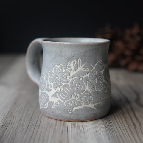 dogwood flower engraved onto a handmade mug