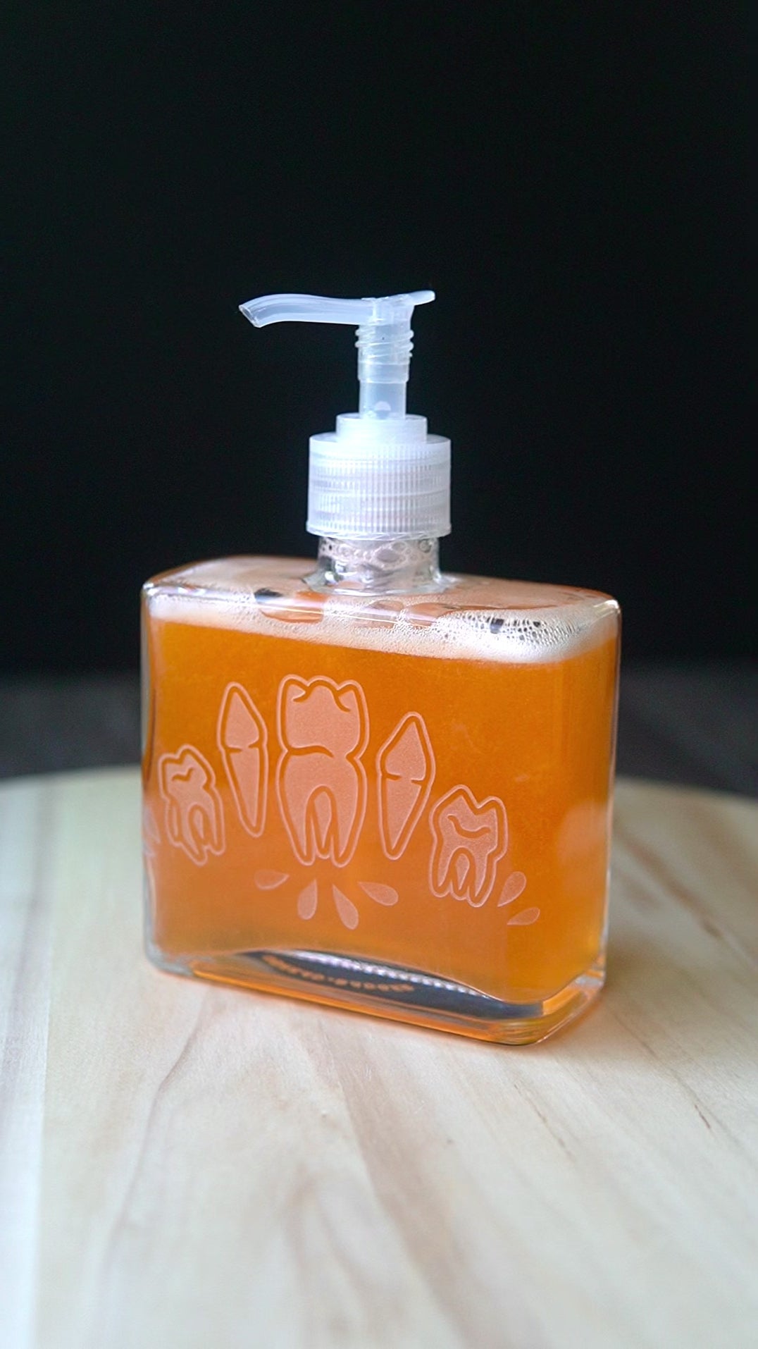 Teeth soap dispenser rotating on a lazy susan.