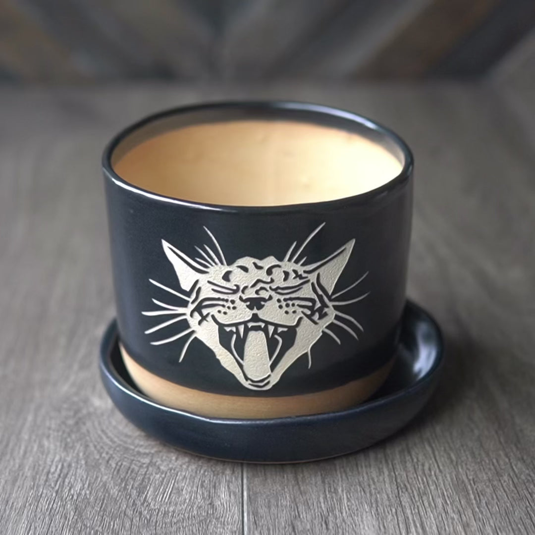 video showing a 4" planter pot from all angles, then some process shots of masking and sandblasting