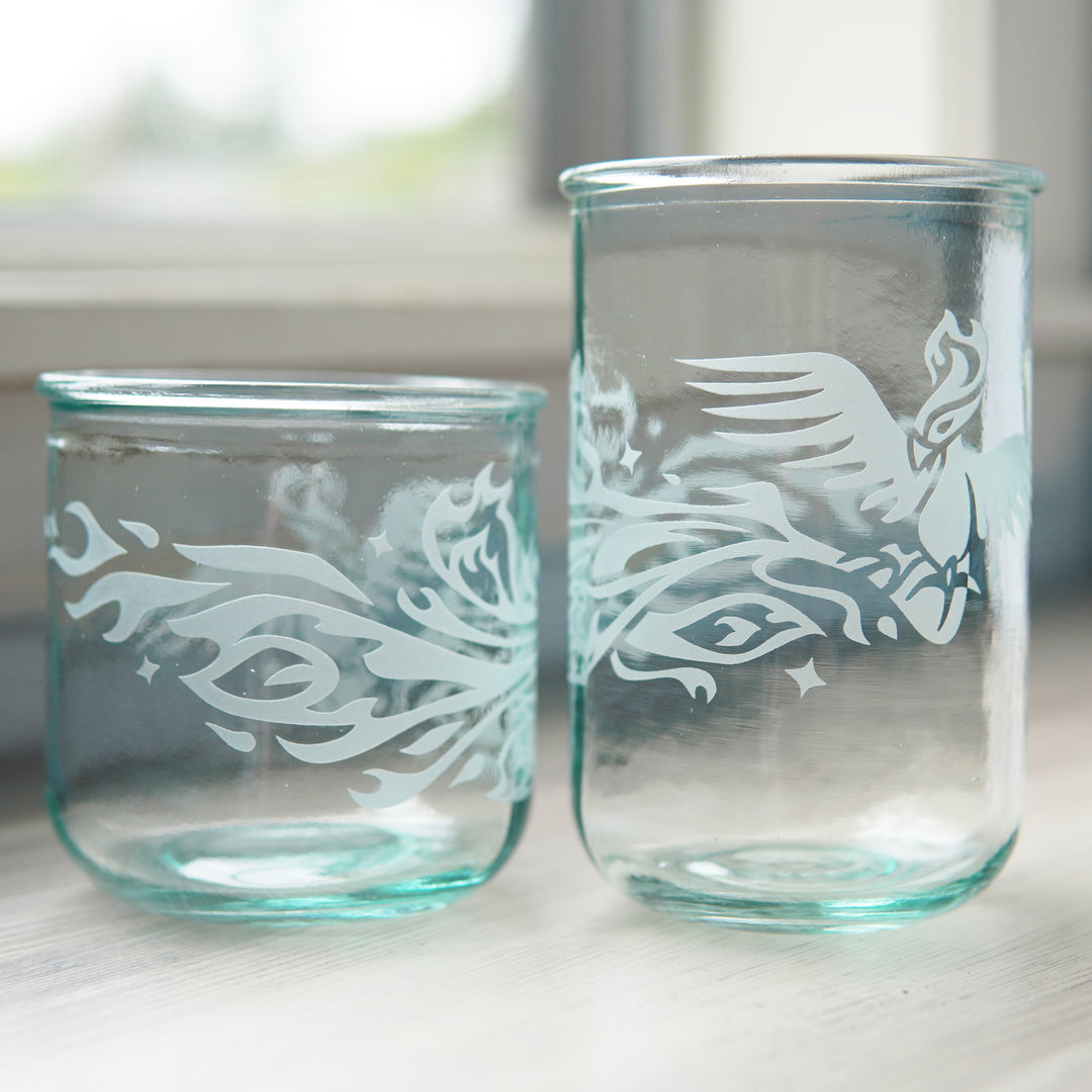 Phoenix bird engraved onto short and tall glassware