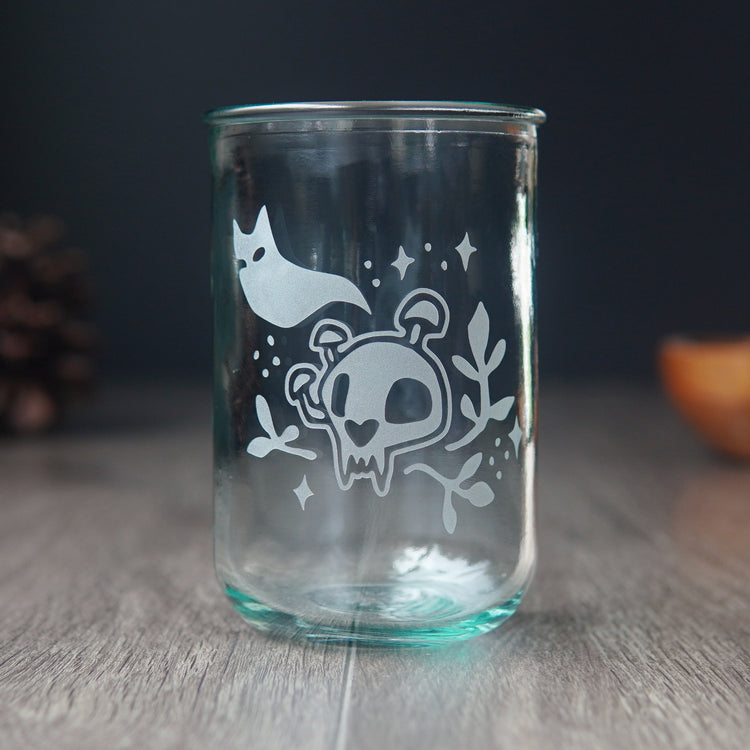 haunted cat skull engraved tall drinking glass with a blue-green tinge