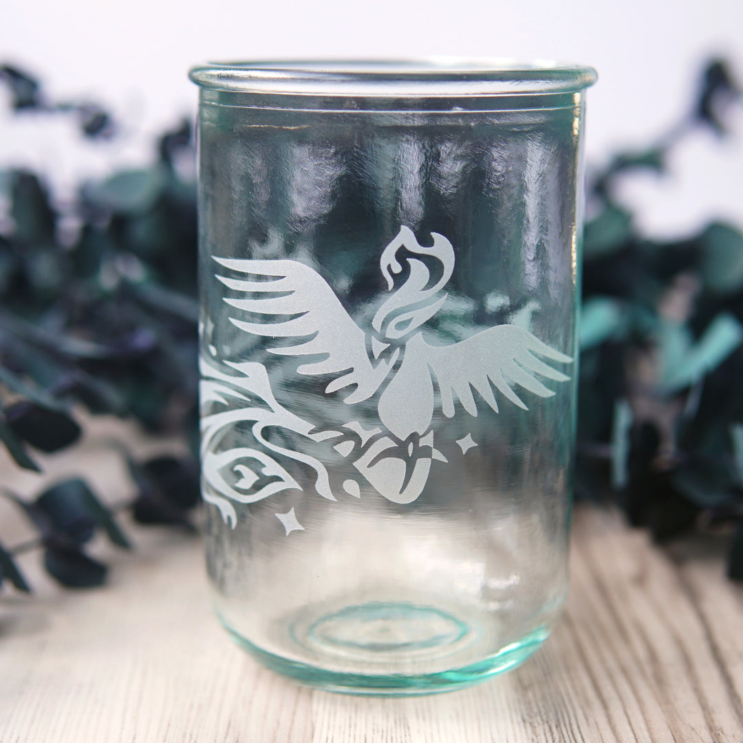 Phoenix bird engraved onto tall glass