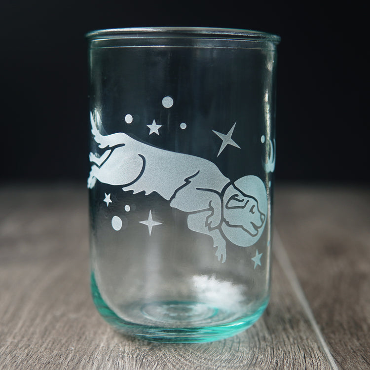 Space dog engraved onto tall recycled drinking glass