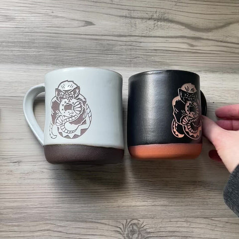 honey badgers eating snakes engraved on handmade clay mugs