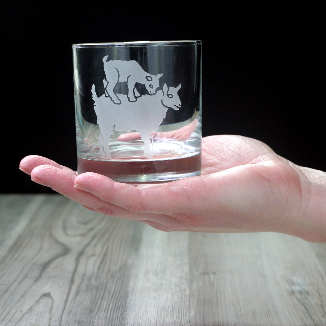 Goat yoga baby kid and mama etched lowball glass held by a white hand