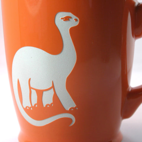 orange brontosaurus coffee mug