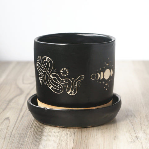 Witchy Snakes + Moon Phase black planter with drainage hole and drip tray