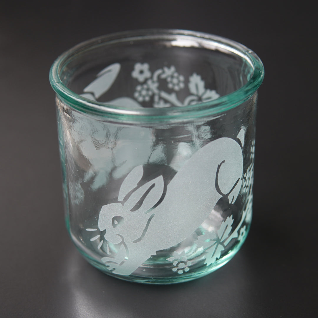 rabbits and blackberry branches engraved onto short glass