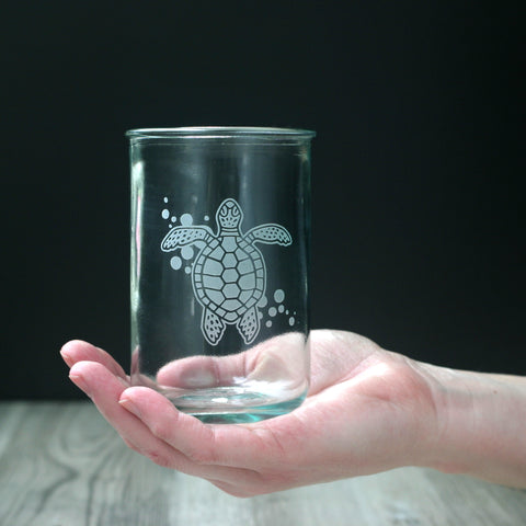 Sea Turtle nautical Tall tumbler made from recycled glass, held in a white person's hand