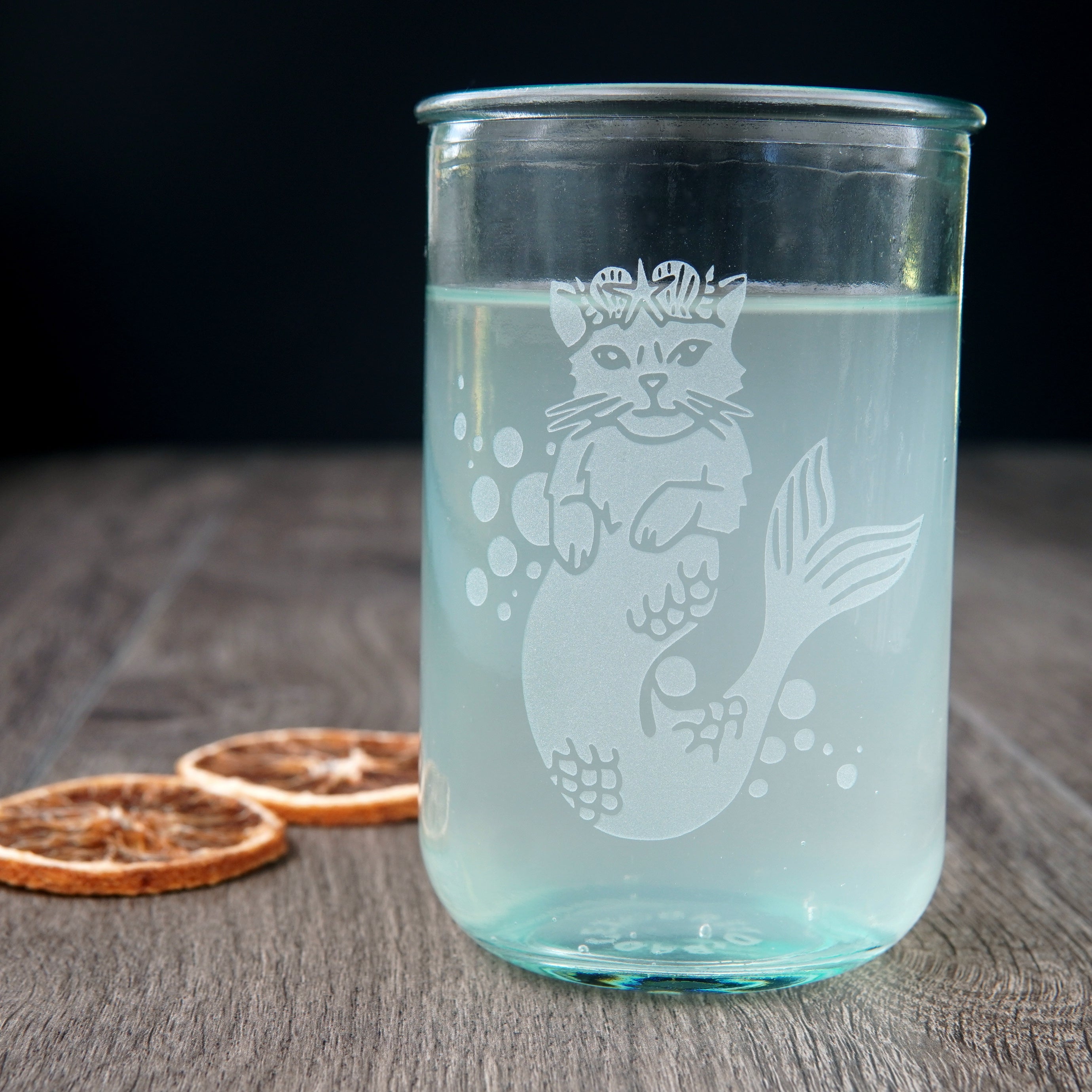 Mermaid Cat etched onto a tall recycled glass cup, full of fizzy hop water