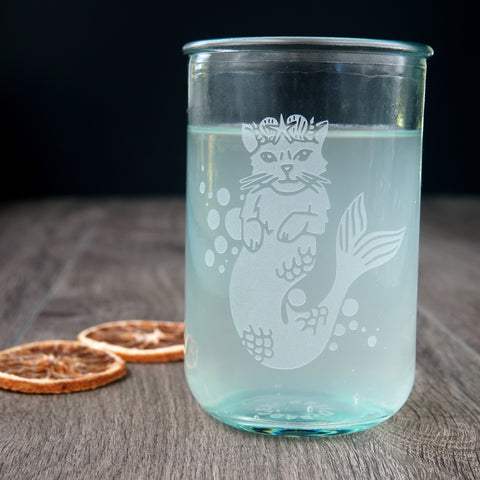 Mermaid Cat etched onto a tall recycled glass cup, full of fizzy hop water