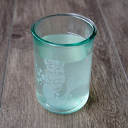 Mermaid Cat etched onto a tall recycled glass cup, filled with flavored setlzer