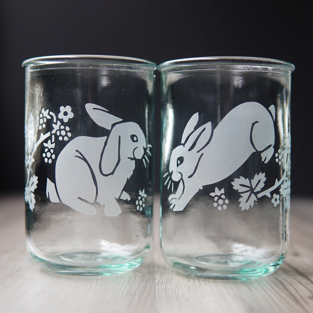 cute rabbits and blackberry branches etched onto a pair of tall glasses