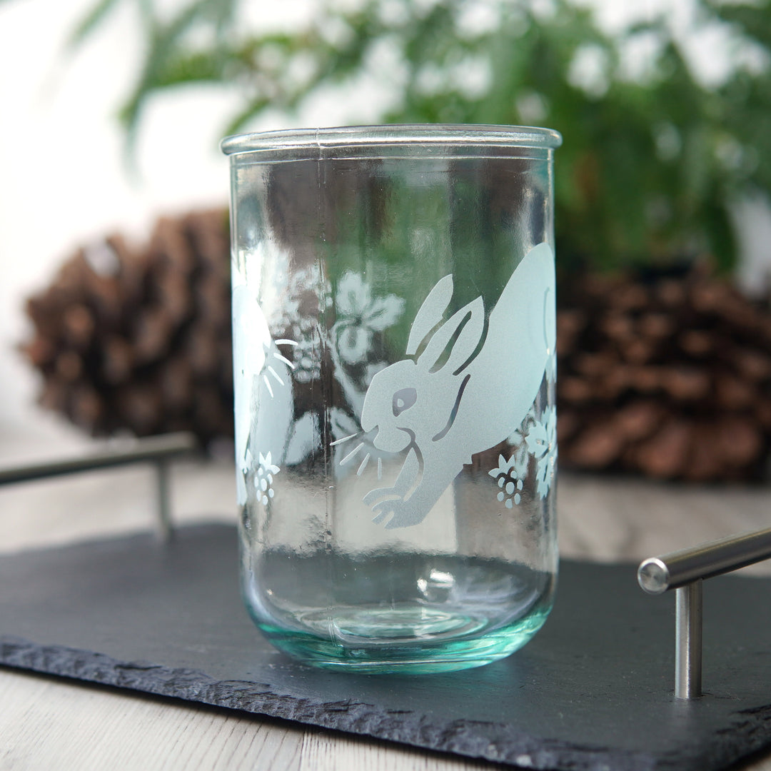 cute rabbits and blackberry branches etched onto a tall glass