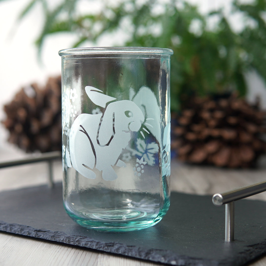 cute rabbits and blackberry branches etched onto a tall glass